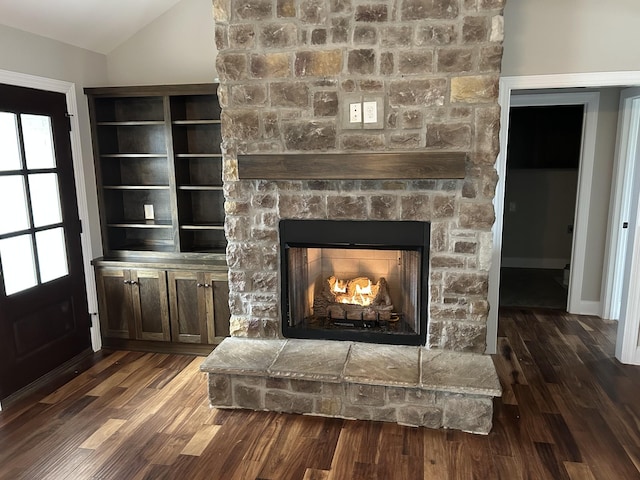 details featuring a stone fireplace and hardwood / wood-style floors