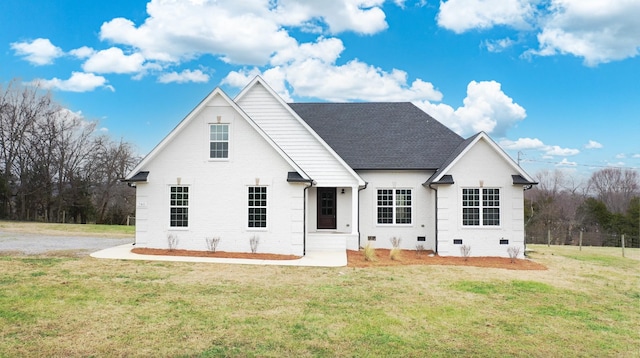 rear view of property with a yard