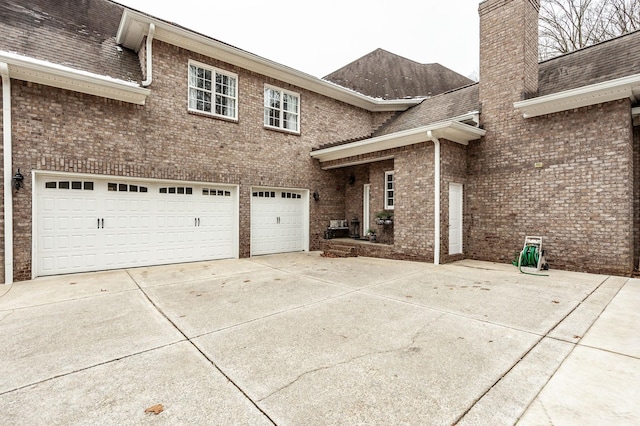 view of property exterior with a garage