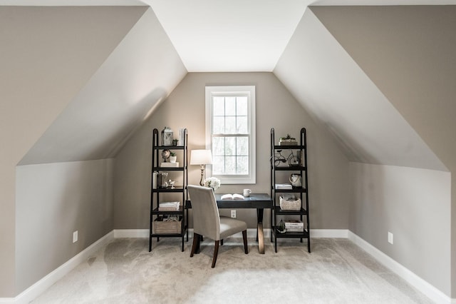 office space featuring carpet floors and vaulted ceiling