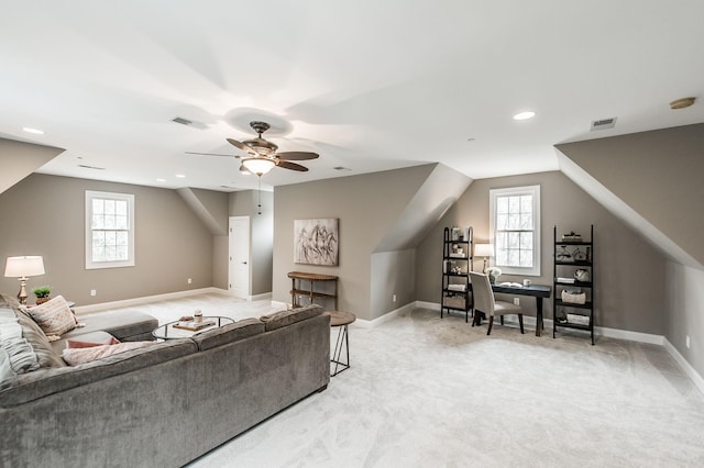 living room with carpet floors, ceiling fan, and lofted ceiling