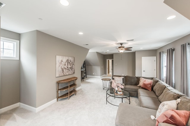 living room featuring ceiling fan and light colored carpet