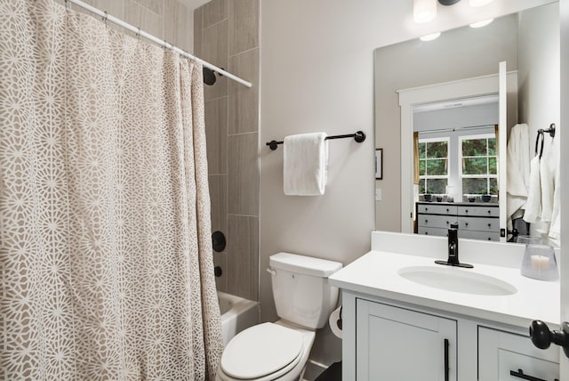 full bathroom featuring vanity, toilet, and shower / tub combo with curtain