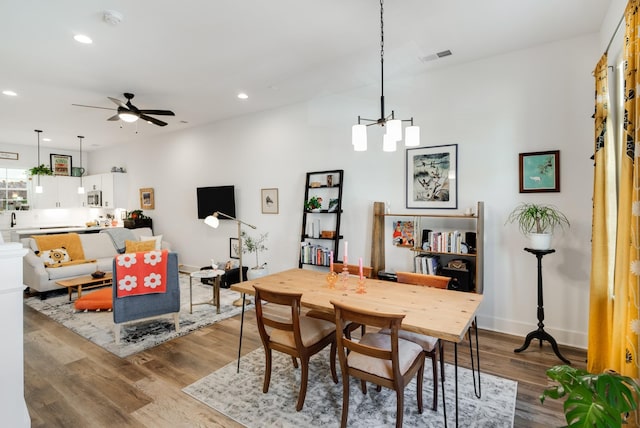 dining space featuring ceiling fan and light wood-type flooring