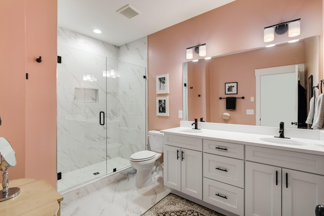 bathroom with vanity, toilet, and an enclosed shower