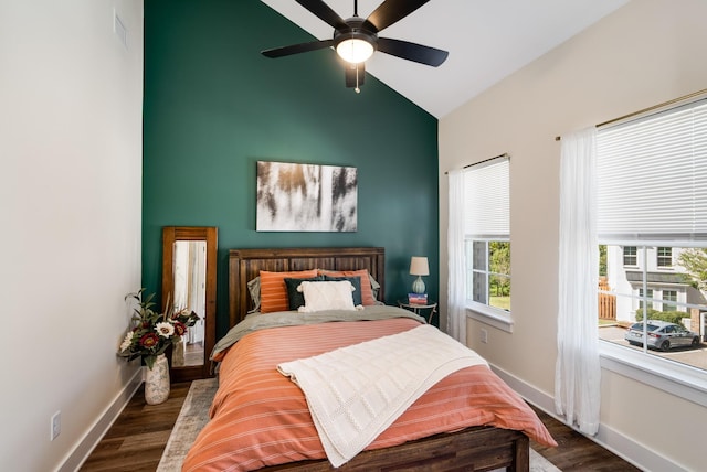 bedroom featuring ceiling fan, dark hardwood / wood-style flooring, and vaulted ceiling