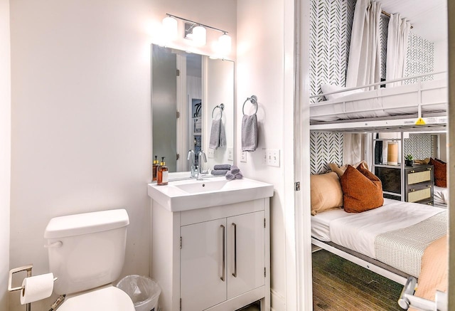 bathroom featuring toilet and vanity