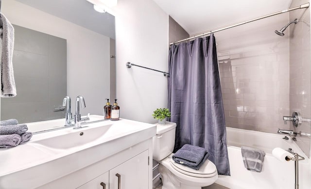 full bathroom featuring toilet, vanity, and shower / bath combo