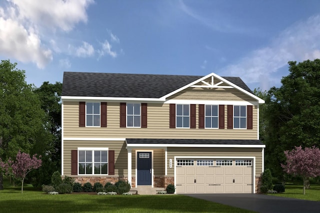 view of front of property featuring a front yard and a garage