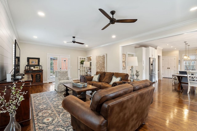 living room featuring crown molding, french doors, and dark hardwood / wood-style floors