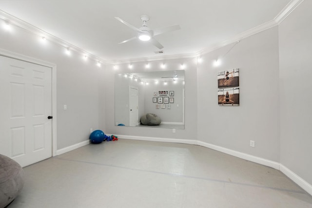 workout area with ceiling fan and ornamental molding