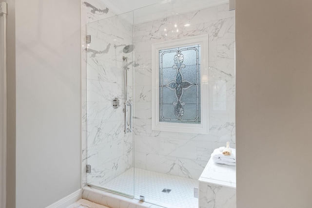 bathroom with a shower with shower door