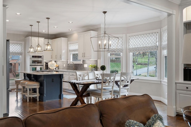 interior space featuring sink, dark wood-type flooring, and ornamental molding