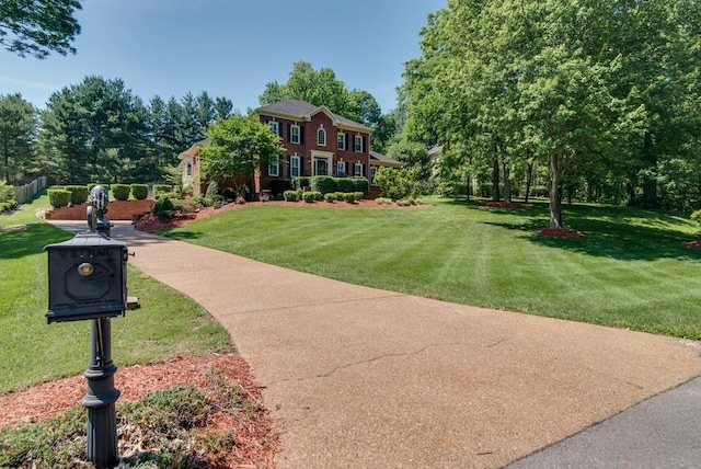 view of home's community with a yard