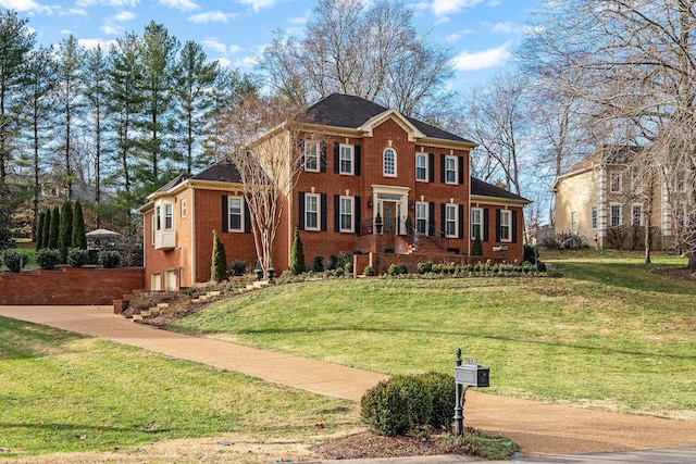 view of front of house with a front lawn and a garage