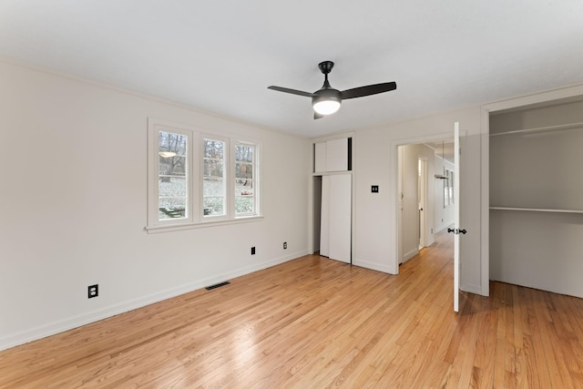 unfurnished bedroom with light hardwood / wood-style flooring and ceiling fan