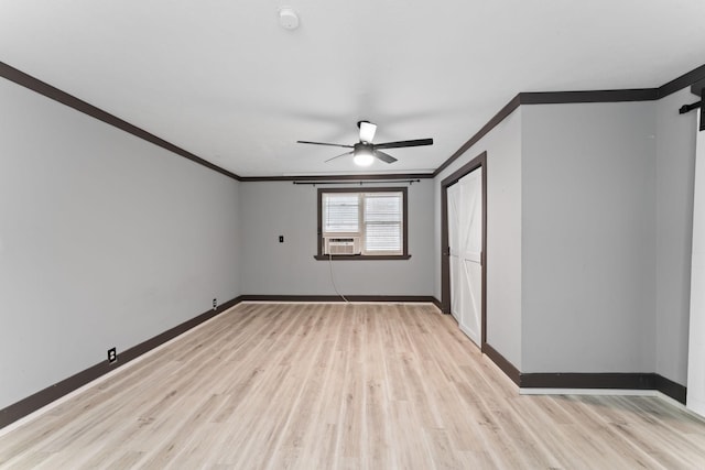 empty room with light wood-type flooring, cooling unit, ceiling fan, and ornamental molding