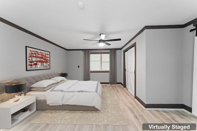 bedroom featuring ceiling fan, crown molding, and light wood-type flooring