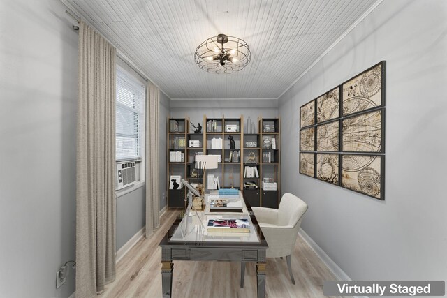 office area featuring light hardwood / wood-style floors, an inviting chandelier, ornamental molding, and cooling unit