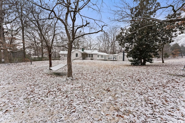 view of yard covered in snow