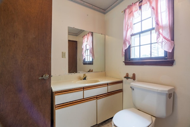 bathroom with vanity and toilet