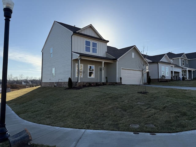 view of front of house featuring a garage and a front lawn