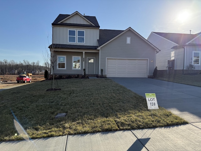 view of front of home with a garage and a front yard