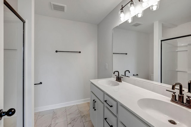 bathroom with an enclosed shower and vanity