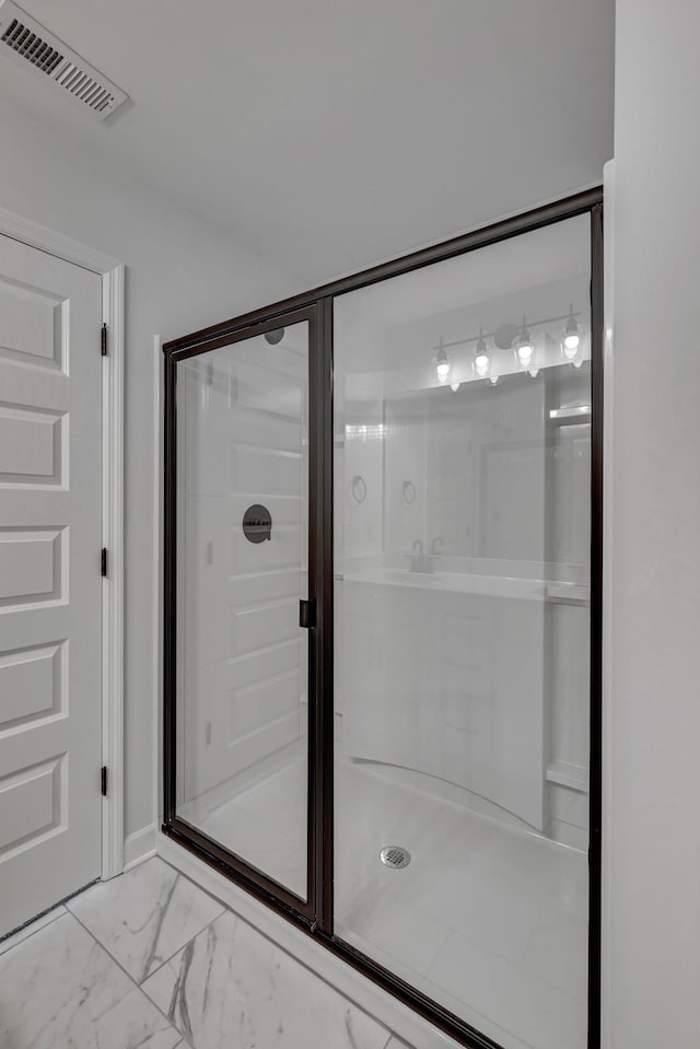 bathroom featuring an enclosed shower