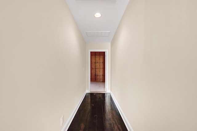 corridor with visible vents, recessed lighting, dark wood-style floors, and baseboards