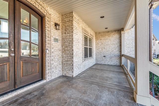 view of patio with french doors and covered porch