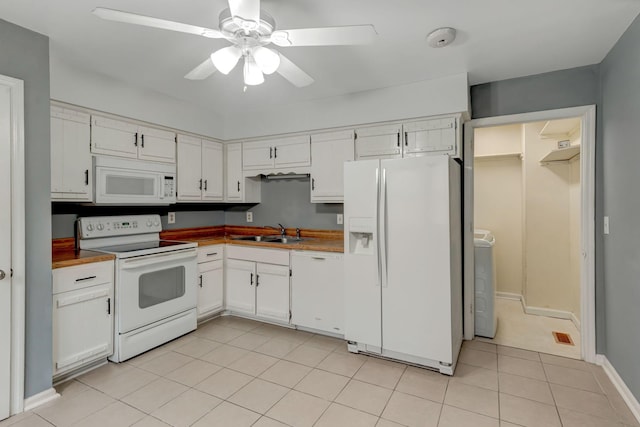 kitchen with white cabinetry, sink, ceiling fan, white appliances, and light tile patterned flooring