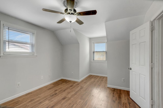 bonus room featuring ceiling fan, wood-type flooring, and vaulted ceiling