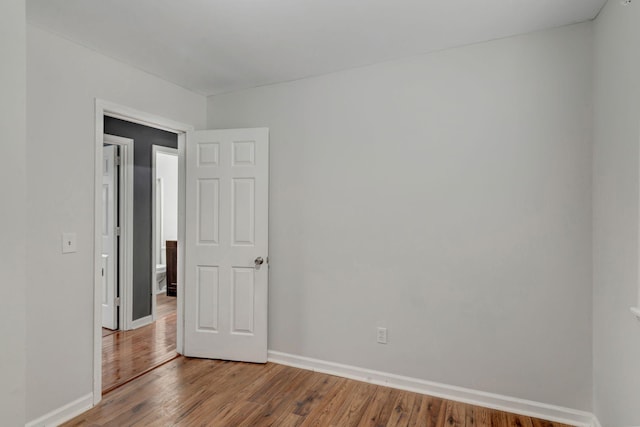 unfurnished room featuring wood-type flooring