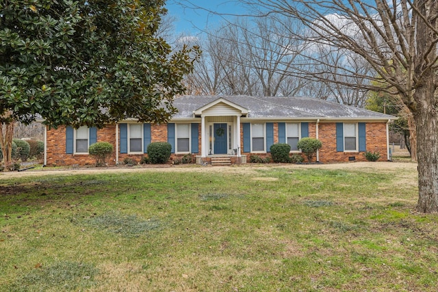 ranch-style home with a front lawn