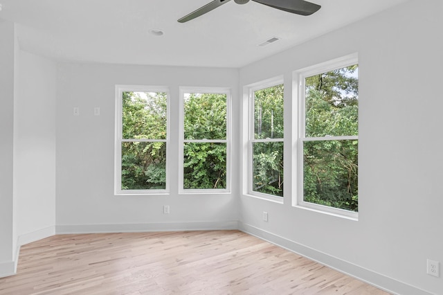 spare room with light hardwood / wood-style floors and ceiling fan