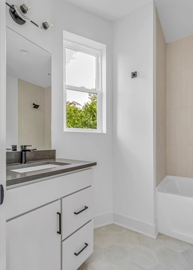 bathroom featuring vanity, bathtub / shower combination, and tile patterned floors