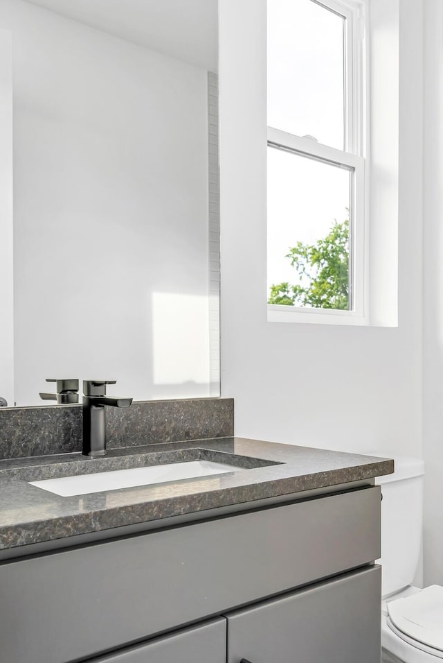 bathroom with vanity and toilet