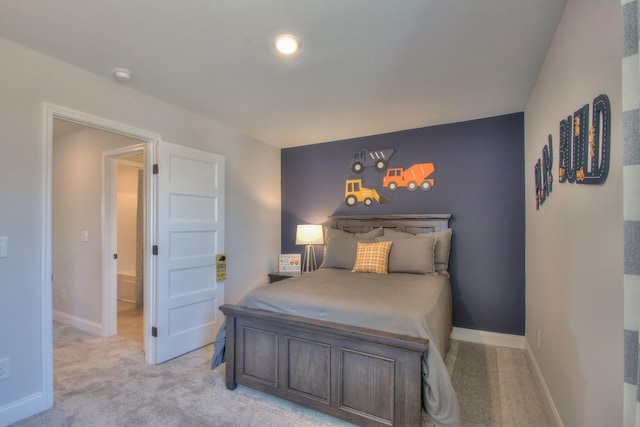 bedroom featuring light carpet