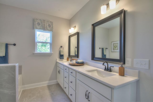 bathroom with vanity and a bathtub