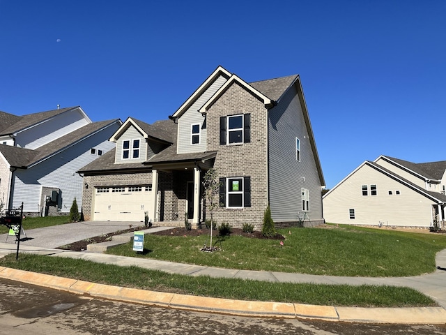 view of front of home featuring a garage and a front lawn