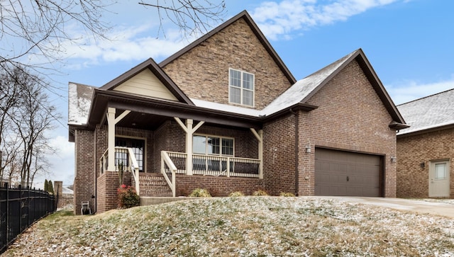 view of front of property with a garage and covered porch