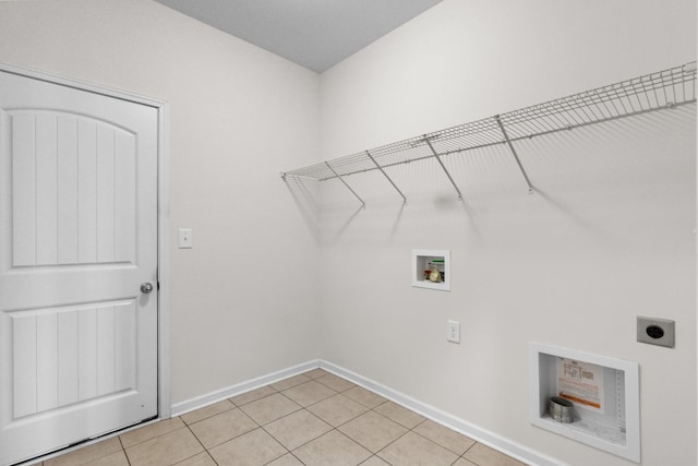 laundry room featuring hookup for an electric dryer, hookup for a washing machine, and light tile patterned floors