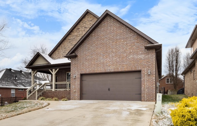 view of front of home with a porch and a garage