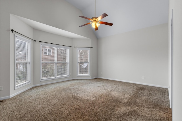 carpeted empty room featuring ceiling fan and high vaulted ceiling