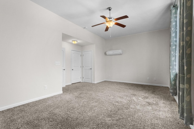 empty room featuring an AC wall unit, ceiling fan, and carpet flooring