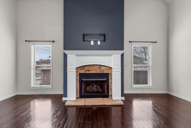 unfurnished living room with hardwood / wood-style floors and a fireplace