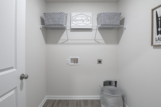 laundry room with hookup for a washing machine, dark hardwood / wood-style floors, and hookup for an electric dryer