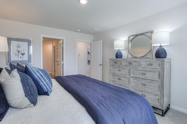 bedroom with light colored carpet