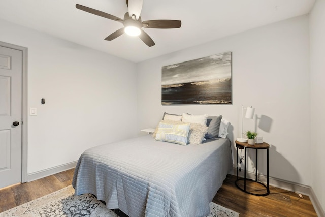 bedroom featuring ceiling fan and dark wood-type flooring